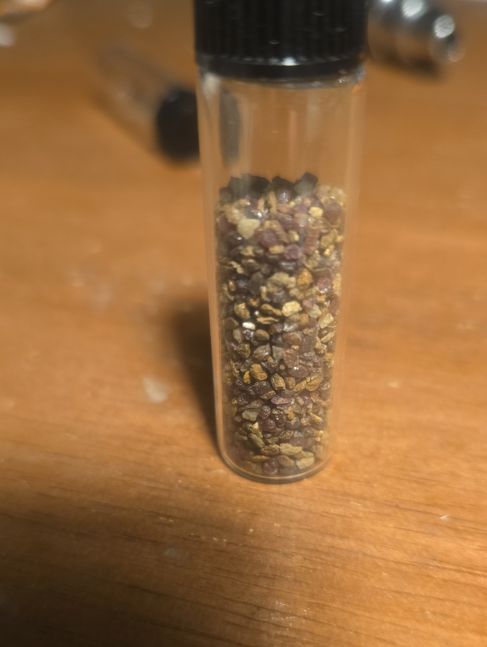 Vial of garnet sand